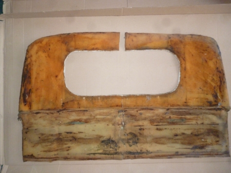 this is rear face of the trim for the cab. the cab  wall was covered in bitumen deadening pads which stuck to the foam 